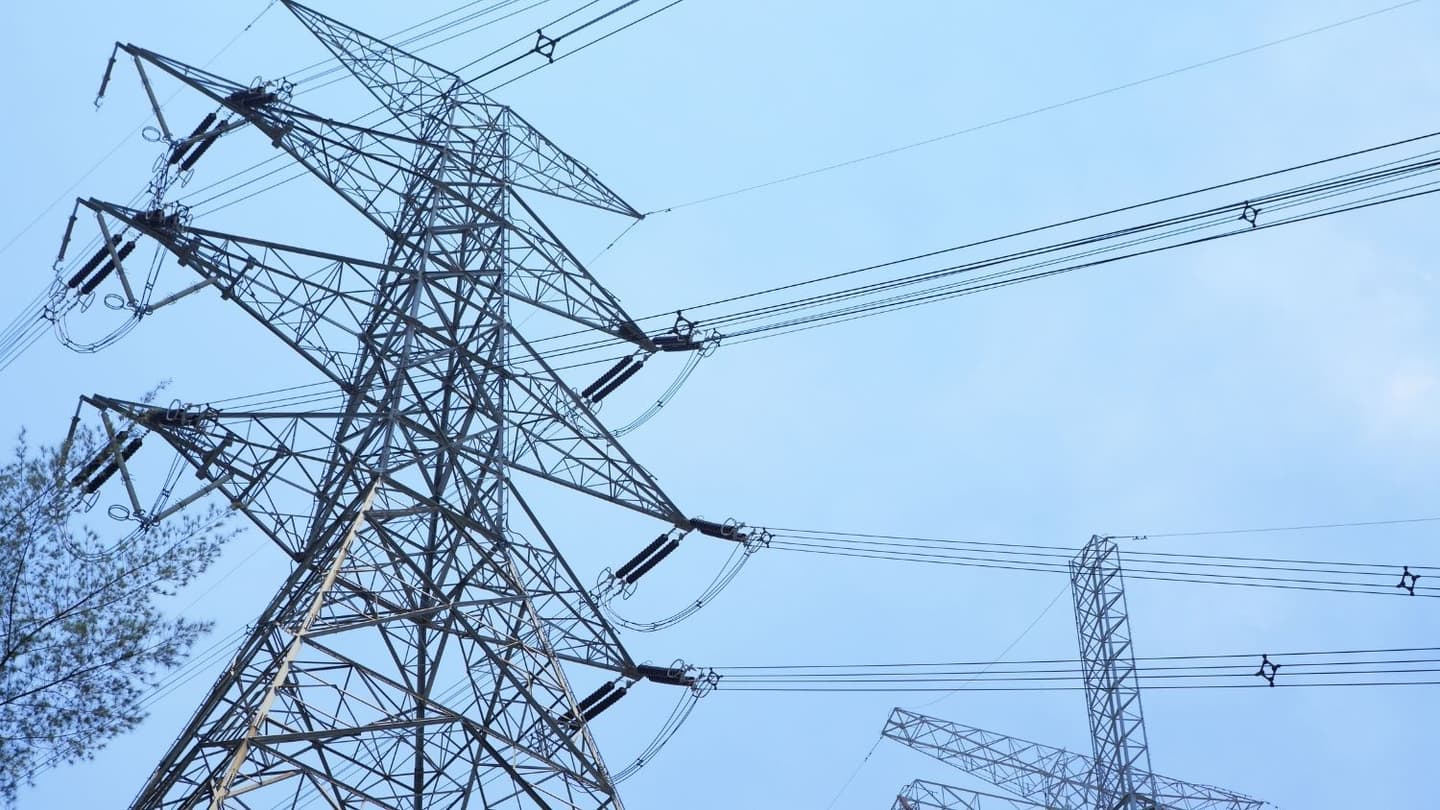 Power transmission lines and towers representing updated RoW compensation guidelines